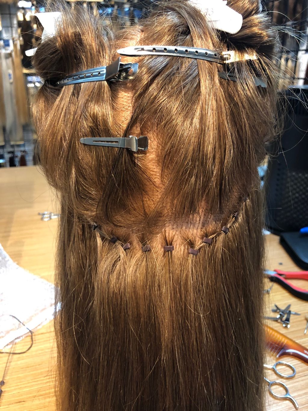 Nape section of Beaded row, Hand Tied, hair extension application